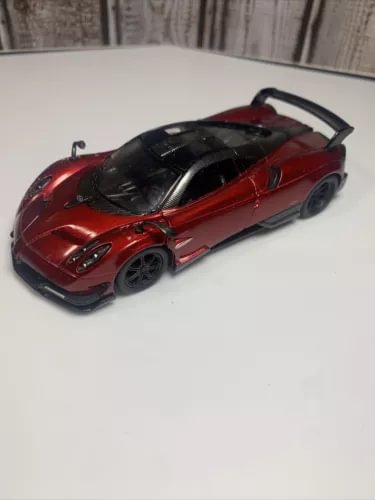 Red and black diecast model toy car with detailed wheels, 1:38 scale body