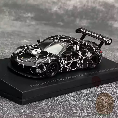 Black Porsche 911 GT3 R race car diecast model with wing and decals