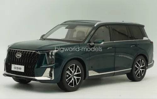 Green 1/18 scale diecast SUV model car with front grille and headlights
