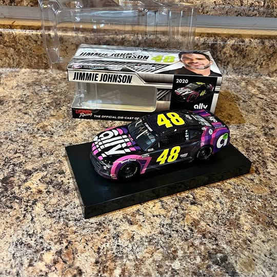 Black and pink diecast race car model, #48, with detailed decals.