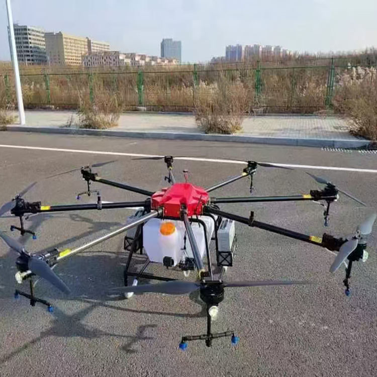 Agriculture crop sprayer drone with multi-rotor frame and red tank