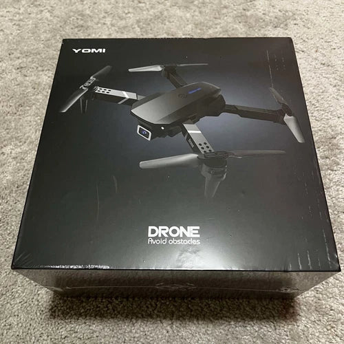 Drone packaging box with YOMI branding and illustrated foldable drone