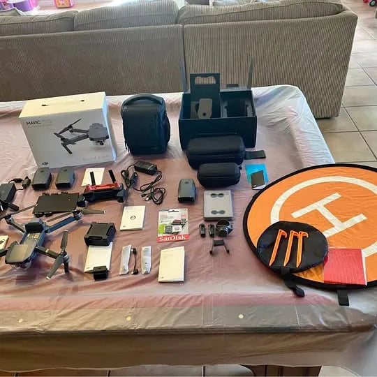 DJI Mavic Fly More Combo drone accessories set, including controller, batteries, and cases