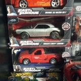Diecast toy car set in clear blister packaging with orange and silver vehicles