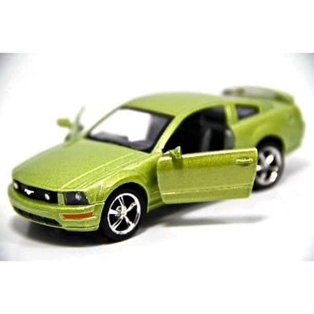 Green 1/38 scale diecast model toy car with black grille and silver wheels