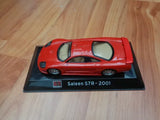 Red Saleen S7R 2001 diecast model car on display base, front view