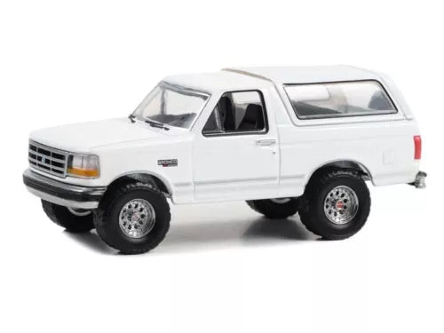 White diecast 1993 Ford Bronco XLT model SUV, side view, Greenlight 1:64