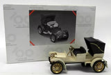 Vintage diecast toy car, cream body with black seats and gold wheels