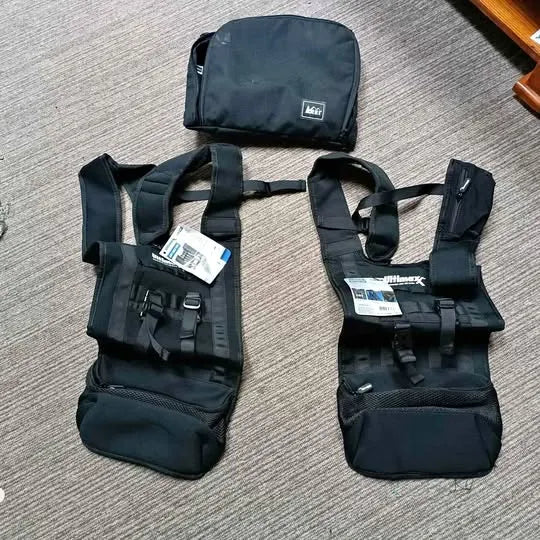 Drone carry vest with multiple straps and front pockets, dark
