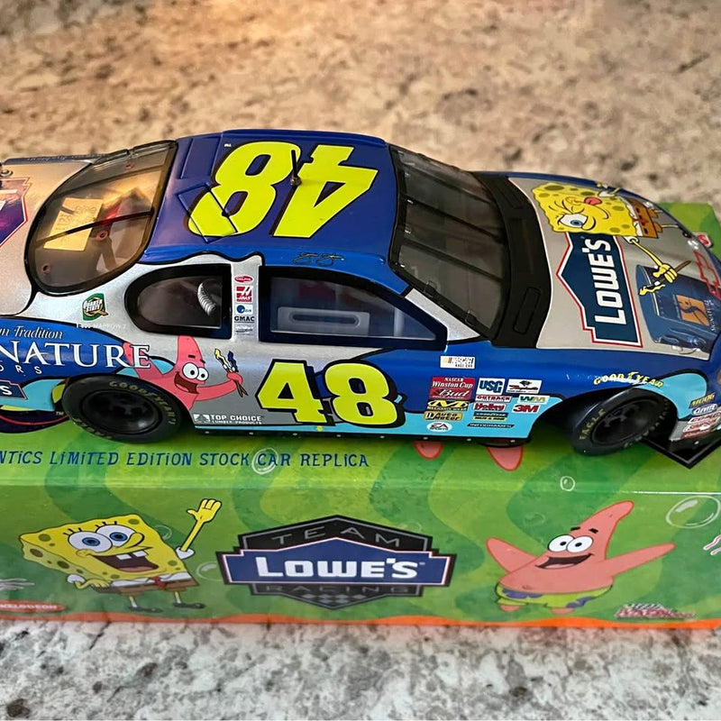 Blue diecast race car with 86 and 48 decals, sponsor logos, front-left view.