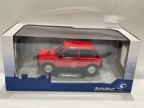 Red 1:18 scale diecast model car in display box, with detailed wheels and decals