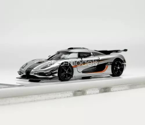 Silver sports diecast model car with black wheels and aerodynamic body