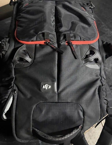 Manfrottto camera and drone backpack with orange trim, front pockets and logo