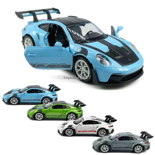 Light blue diecast race car model with black hood and large rear spoiler, 1:36 scale