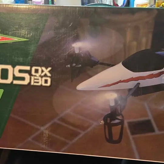 RC drone packaging with illustrated drone and ETHOS QX 130 text, front view
