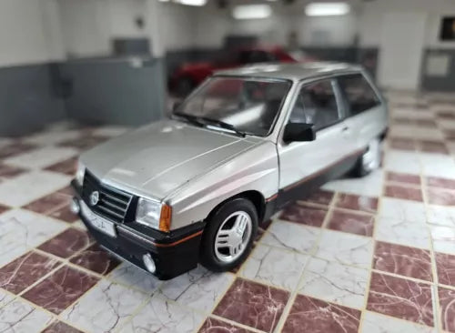 1/24 scale diecast car model, silver with black front bumper and grille