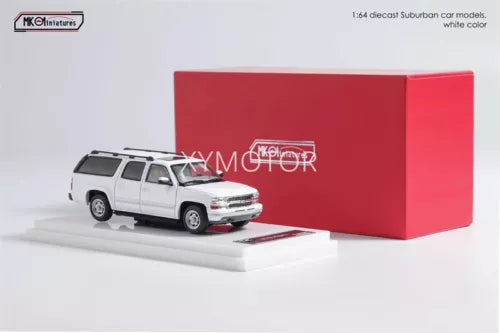 White and silver diecast model SUV, 2003 Chevrolet Suburban with front 3/4 view