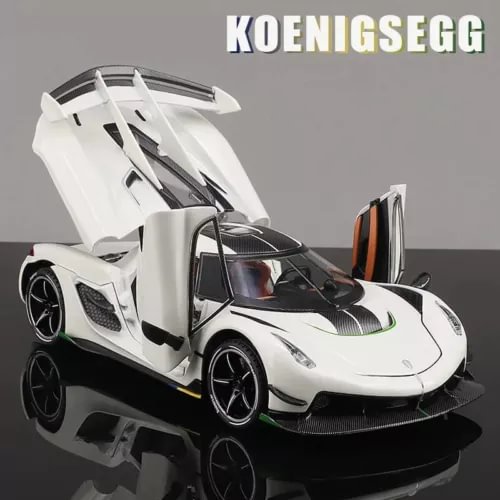 White alloy sport car model with open scissor doors and black carbon accents
