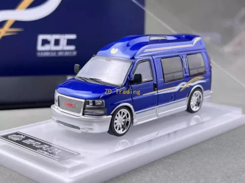 Blue metal diecast van model, front three-quarter view on display base