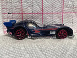 Blue and black diecast race car with red wheels and side graphics