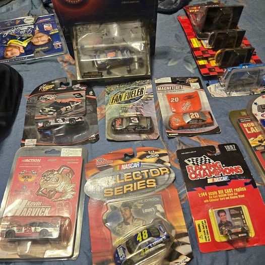 Diecast race car figures in retail blister packs, assorted designs