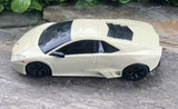 Ivory 1:24 scale diecast sports car model with black wheels and side vents