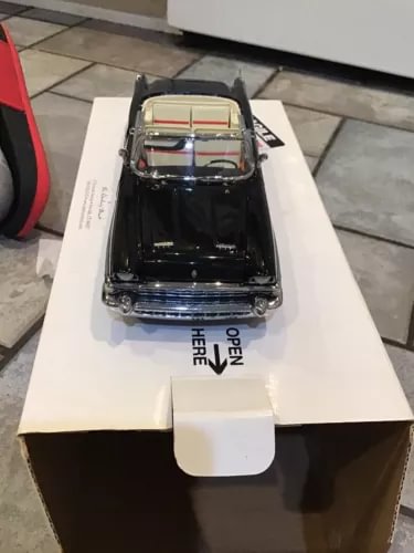 1:24 diecast convertible model car, black body with blue grille and chrome trim
