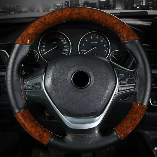 Diecast steering wheel with woodgrain rim and dashboard gauges visible