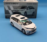 Diecast mini van model car, white with black grille, front 3/4 view