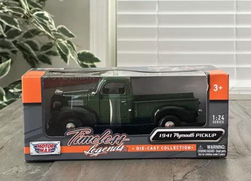 Green 1941 Plymouth pickup diecast truck, 1:24 scale, in retail box
