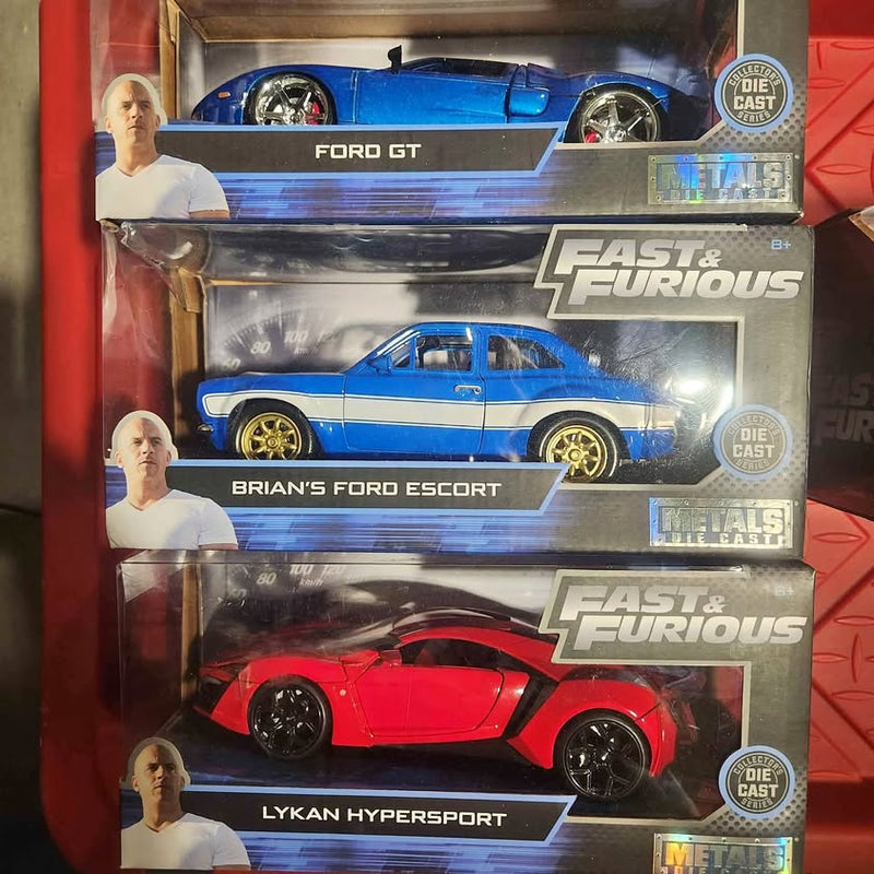 Die-cast vehicle set with blue Ford GT, blue Ford Escort, and red Lykan Hypersport cars