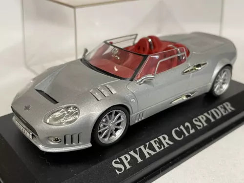 1:43 diecast supercar model in silver gray with red interior, open-top cockpit