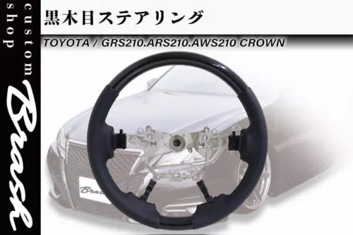 Diecast model steering wheel and dashboard parts with black wheel and gray details