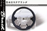 Diecast model steering wheel and dashboard parts with black wheel and gray details