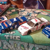 Diecast racing cars with track accessory, blue and white #1 and red #1 cars
