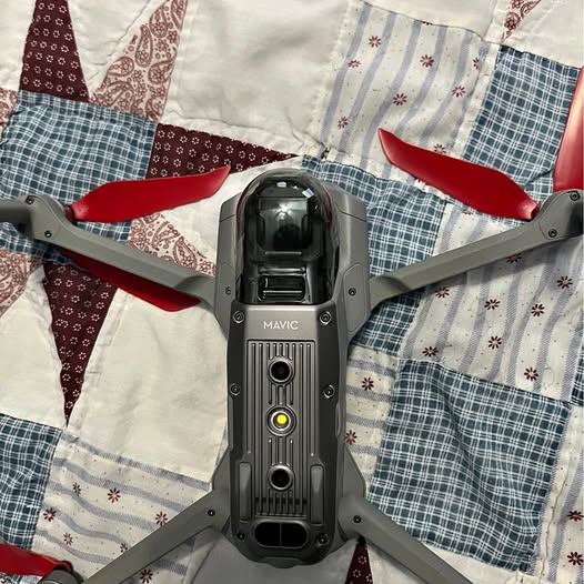 Grey DJI Mavic 2 drone with four propellers and camera gimbal housing