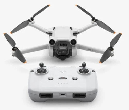 DJI Mini 3 Pro drone with four rotors and white remote controller