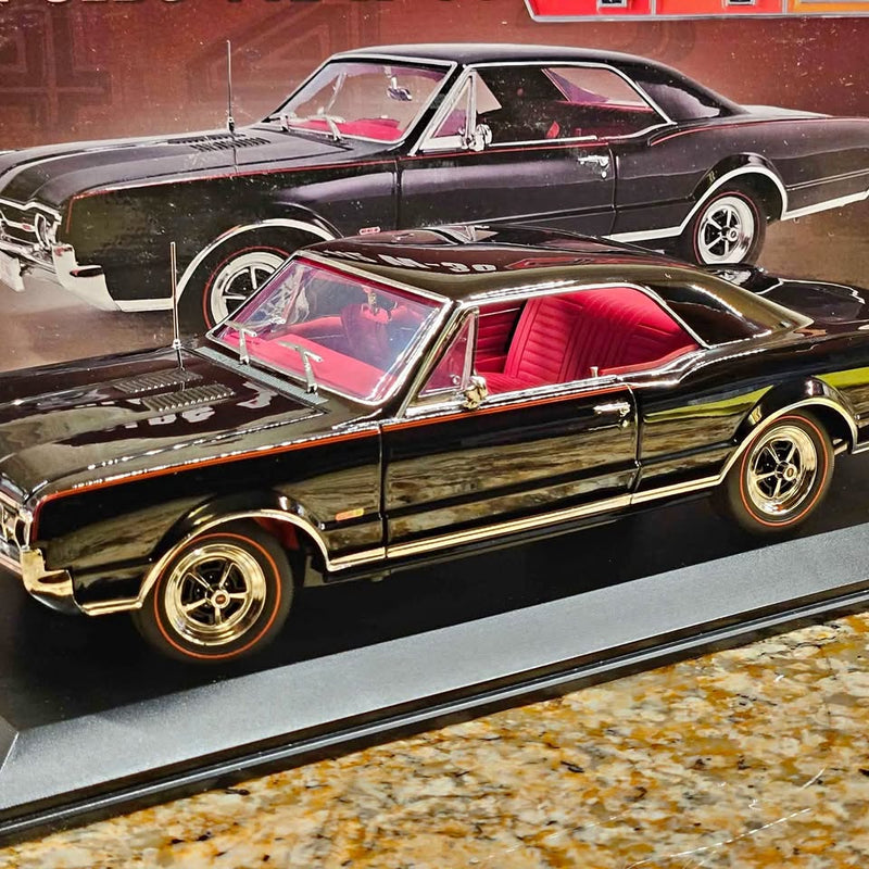 1:18 Oldsmobile 442 W30 diecast car, black with red interior