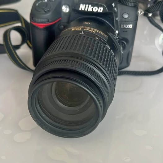 Nikon D7000 DSLR camera with attached lens