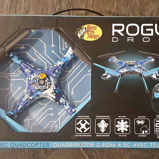Blue quadcopter drone with four propellers shown on retail package front