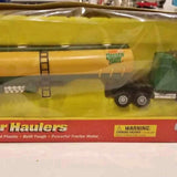 Yellow diecast semi hauler model with trailer ladders and black wheels
