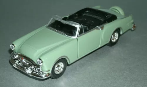 Light green open-top diecast model car with chrome grille, front three-quarter view