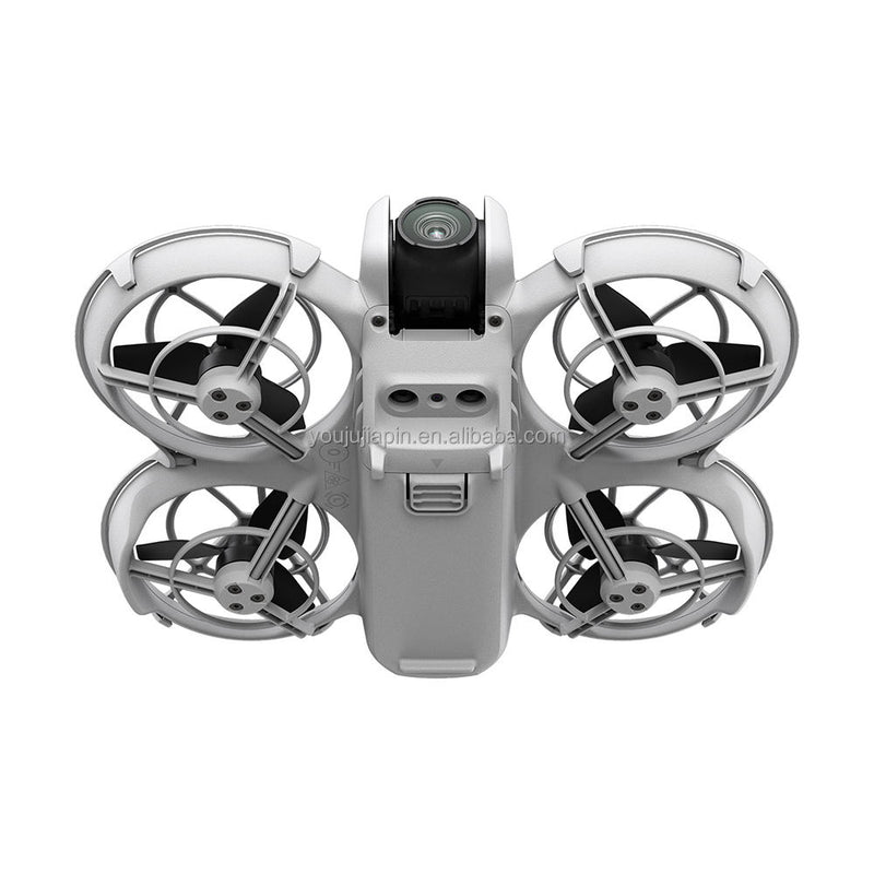 Gray quadcopter drone with four propellers and front camera module