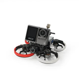 FPV cinewhoop drone with camera, black frame and red/white prop guards