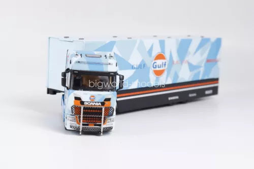 Diecast model truck with trailer, front view, orange and white cab