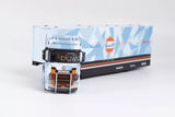 Diecast model truck with trailer, front view, orange and white cab