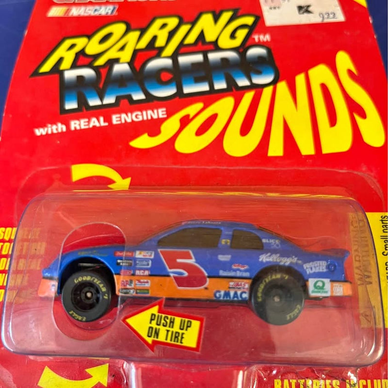 Blue and orange diecast stock car in red blister package with clear window