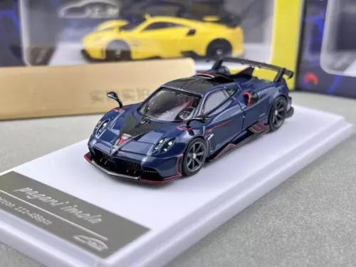 Blue sports diecast metal car, front three-quarter view, detailed grille and headlights