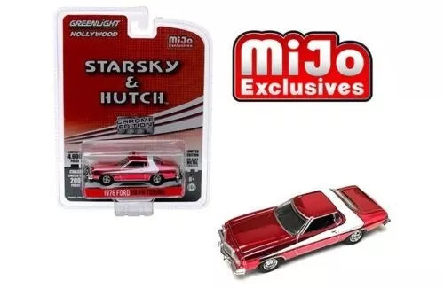 Red diecast toy car with black roof in blister pack