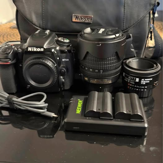 Nikon DSLR camera kit with dual lenses and lens caps